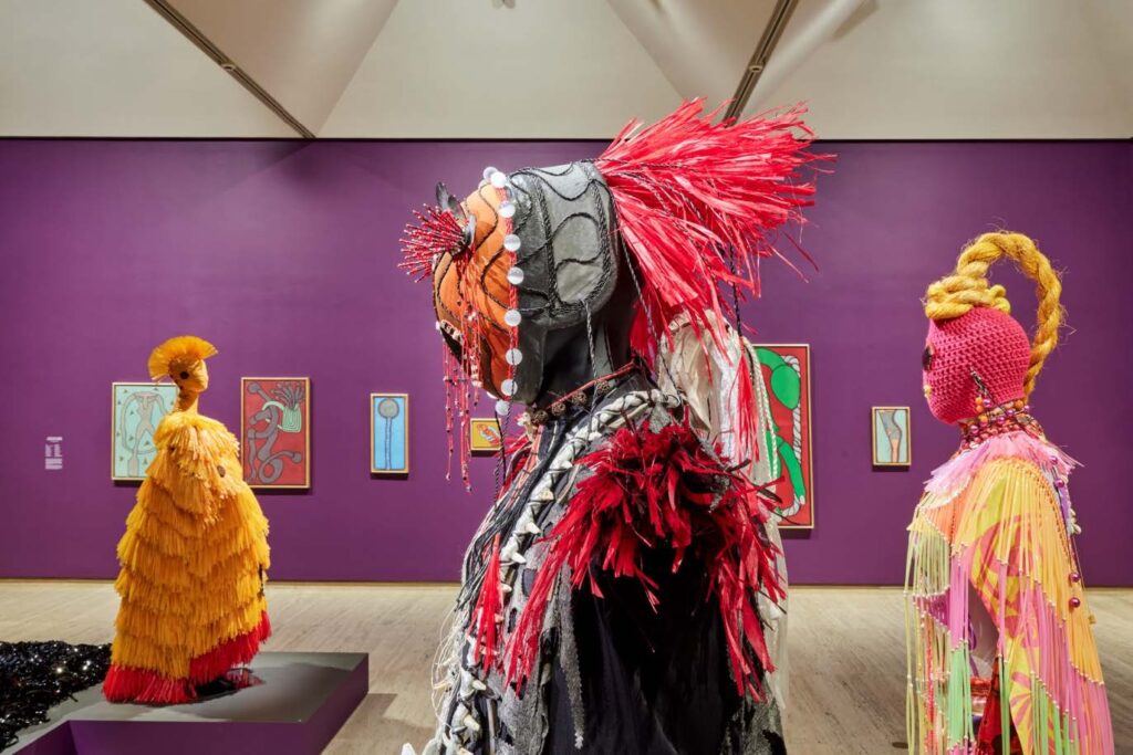 Installation view, Ten Thousand Suns, 24th Biennale of Sydney 2024, Art Gallery of New South Wales, featuring art by Pacific Sisters (foreground) and Robert Gabris (wall) photo © Art Gallery of New South Wales, Christopher Snee.